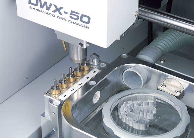 2011 Roland expands its dental mill line with the DWX-50, featuring 5-axis machining capability and an automatic tool changer for production of dental prosthetics.