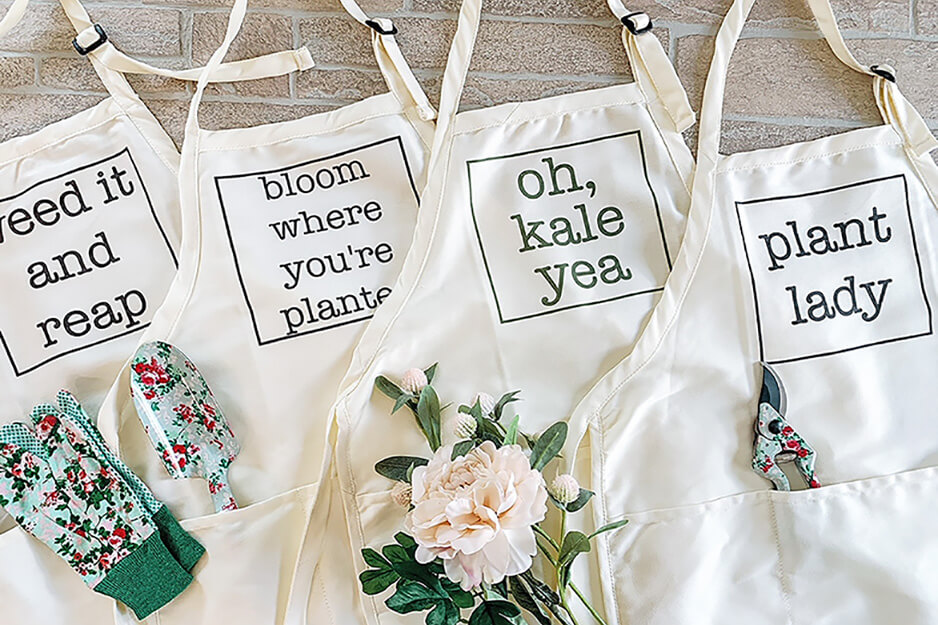 Wendy and Wander printed these four plant-themed aprons using its Roland DG VersaStudio BT-12 DTG printer.