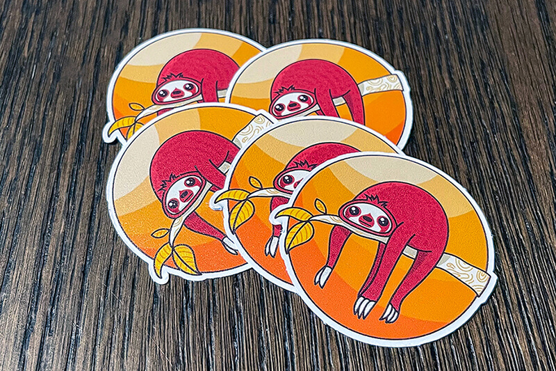 Colorful stickers like these of sloths are a specialty at Arteehub, produced on their Roland DG printers.