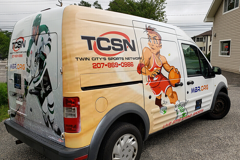 Image shows TCSN van wrapped in colorful graphics by East Coast Sign and Design, printed on East Coast's Roland DG TrueVIS VG2 printer/cutter.