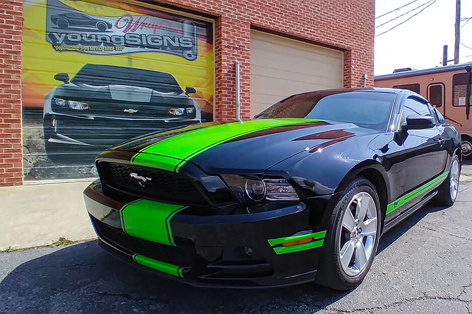 Young Signs produced neon green strips for this black Mustang car on its Roland DG TrueVIS VG2 printer/cutter.