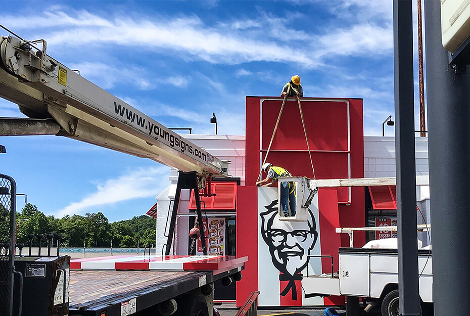 Young Signs uses a crane truck to install signage for a local KFC, produced on its Roland DG TrueVIS VG2 printer/cutter.