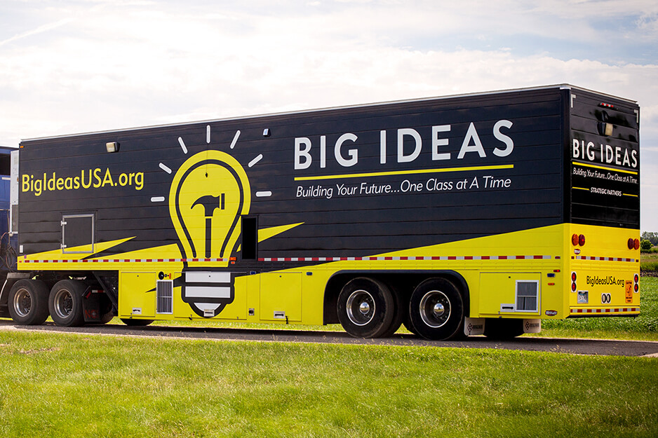 Bus covered in "Big Ideas" graphics, wrapped by Fuel Graphics and printed on its Roland DG TrueVIS VG2-540 digital printer/cutter.